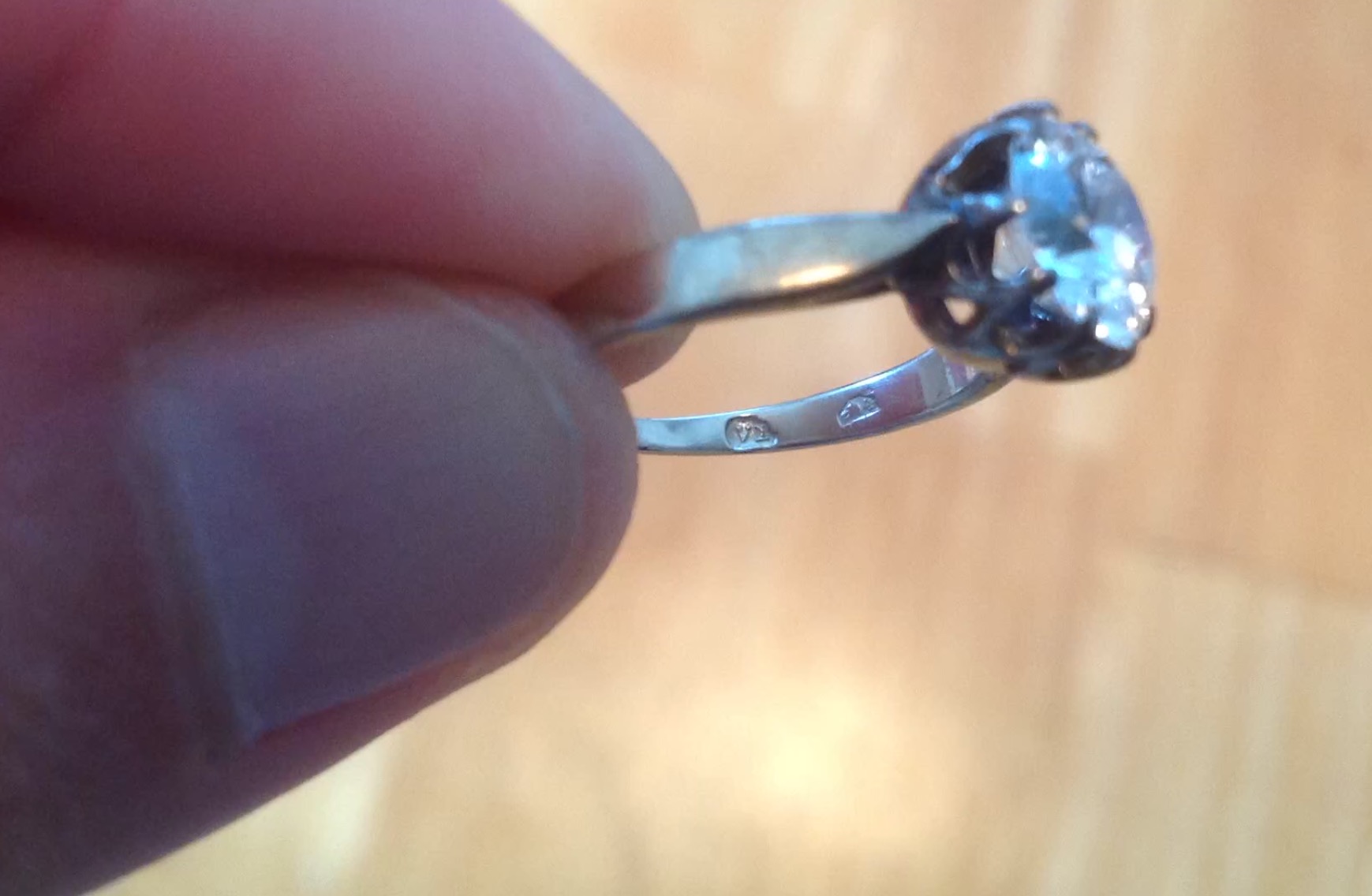 Need help identifying marks on white gold ring